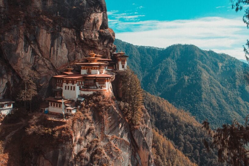 Paro Taktsang temple in Bhutan viewing mountain under blue and white sky